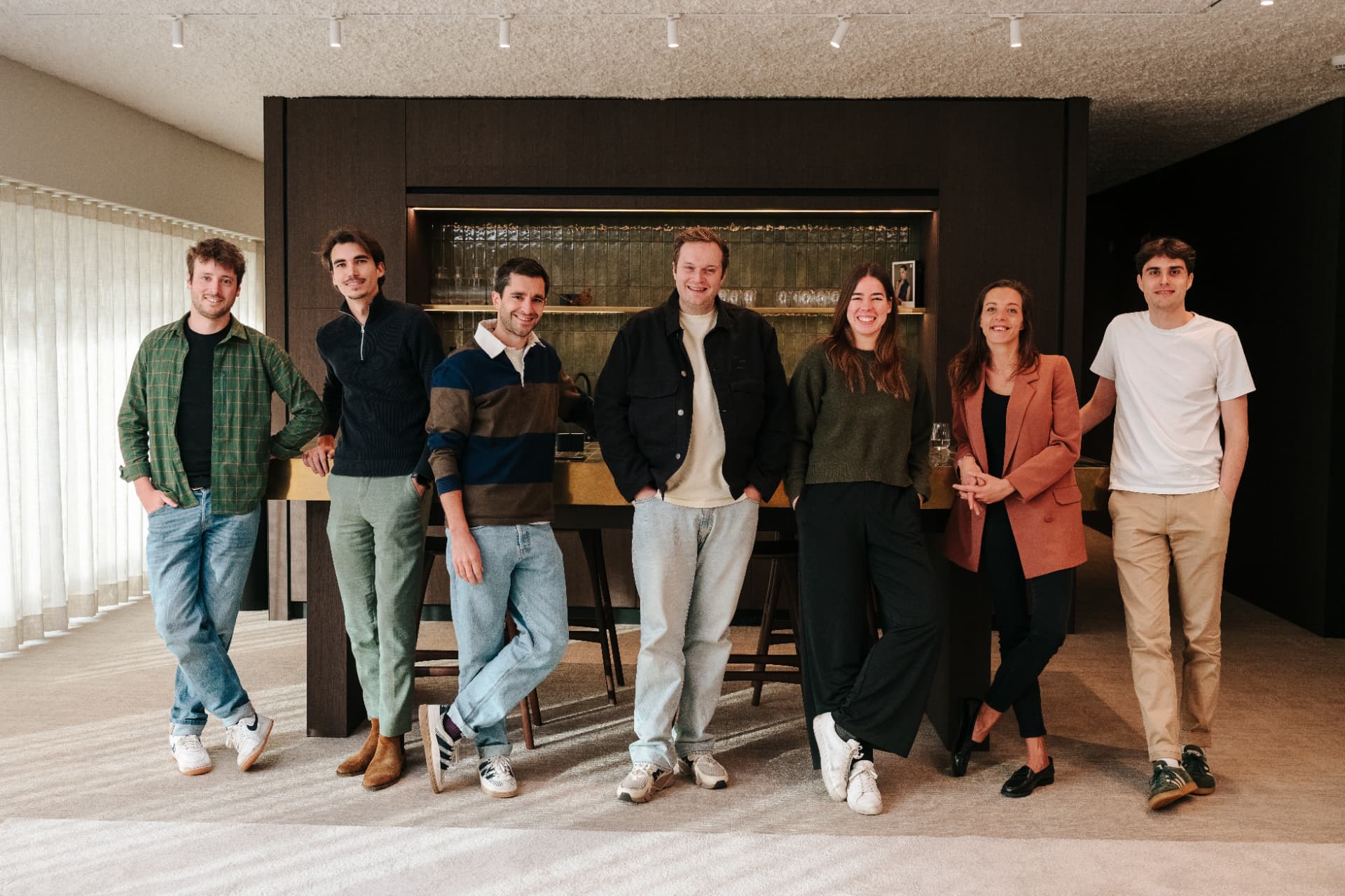 The Inku team standing together in the Leuven office